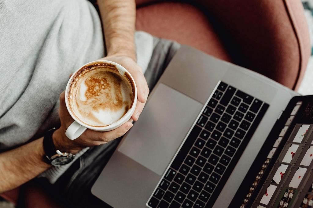 Neatly organized home office desk with trays and cable management