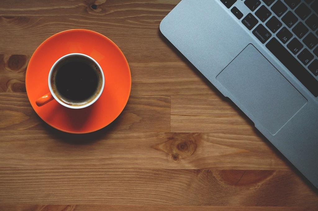 Living room coffee table with organized remotes and magazines